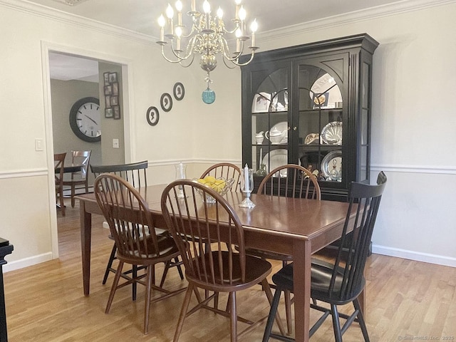 1040 Purchase Brook Rd, Southbury, CT 06488 - dining room featuring a chandelier, light wood finished floors, and crown molding