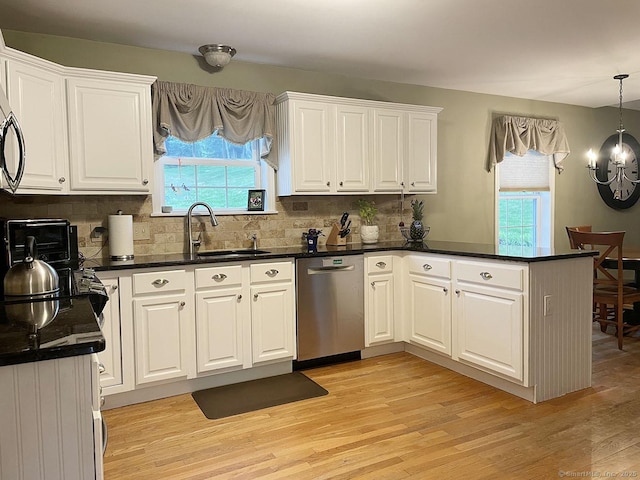 1040 Purchase Brook Rd, Southbury, CT 06488 - kitchen with stainless steel dishwasher, a peninsula, white cabinetry, and decorative backsplash