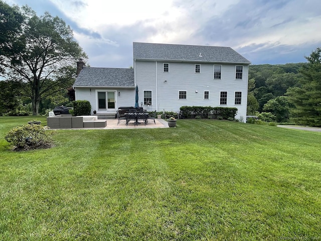 1040 Purchase Brook Rd, Southbury, CT 06488 - back of house featuring a patio, a chimney, and a yard