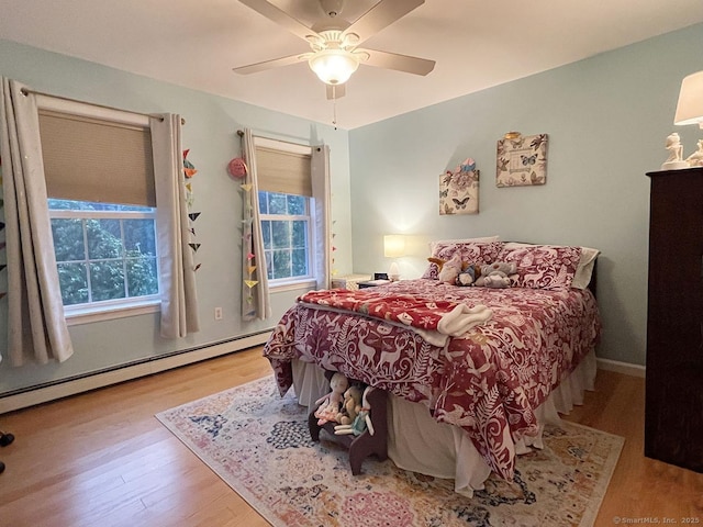 1040 Purchase Brook Rd, Southbury, CT 06488 - bedroom with a baseboard heating unit, wood finished floors, and a ceiling fan