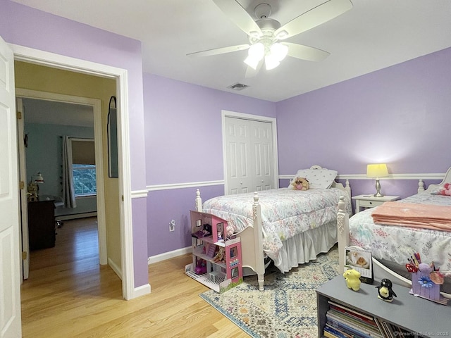 1040 Purchase Brook Rd, Southbury, CT 06488 - bedroom with wood finished floors, a closet, a ceiling fan, and a baseboard heating unit