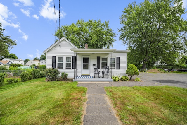47 Park Ave, Enfield, CT 06002 - bungalow-style house with covered porch and a chimney