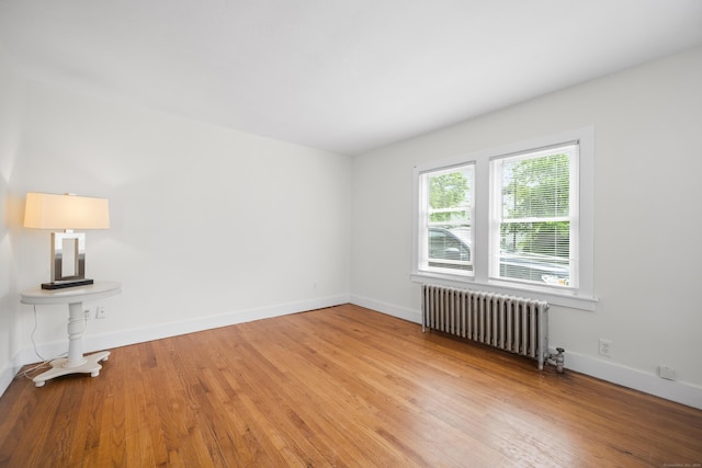 47 Park Ave, Enfield, CT 06002 - unfurnished room with radiator heating unit and light wood finished floors