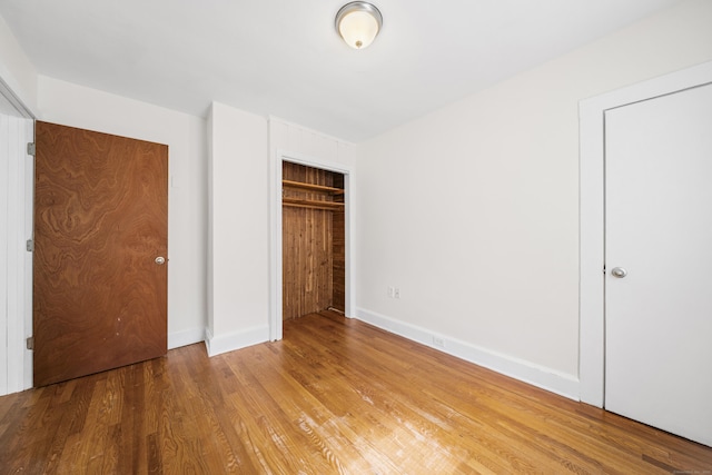 47 Park Ave, Enfield, CT 06002 - unfurnished bedroom featuring wood finished floors and a closet