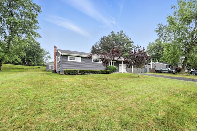 24 Westerly Dr, Enfield, CT 06082 - view of front of home featuring a chimney and asphalt driveway