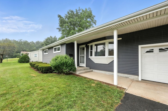 24 Westerly Dr, Enfield, CT 06082 - doorway to property with a yard and a garage