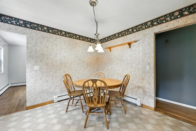 24 Westerly Dr, Enfield, CT 06082 - dining space featuring a baseboard heating unit, a chandelier, and a textured ceiling
