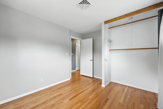 24 Westerly Dr, Enfield, CT 06082 - unfurnished bedroom with light wood finished floors and a closet