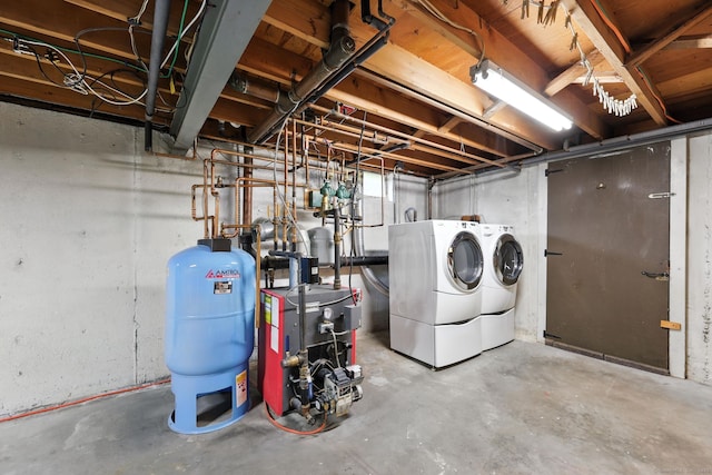 24 Westerly Dr, Enfield, CT 06082 - unfinished below grade area featuring a water pressure tank, washer and dryer, and a heating unit