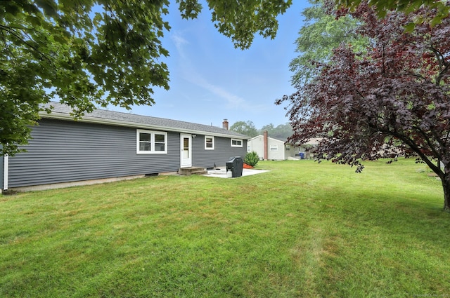 24 Westerly Dr, Enfield, CT 06082 - rear view of property with a lawn, a patio, and a chimney