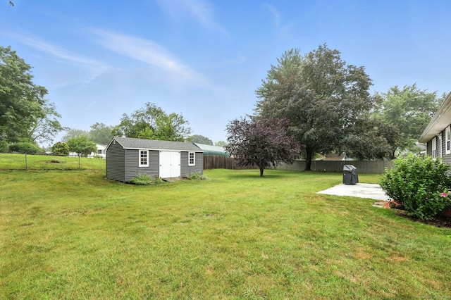 24 Westerly Dr, Enfield, CT 06082 - fenced backyard with a patio and a storage unit