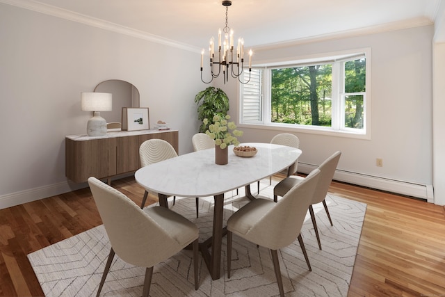 59 Judith Dr, Danbury, CT 06811 - dining area featuring a baseboard heating unit, ornamental molding, a chandelier, and light wood-style flooring