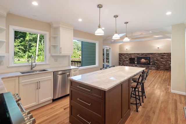 59 Judith Dr, Danbury, CT 06811 - kitchen with open shelves, dishwasher, a brick fireplace, white cabinetry, and recessed lighting