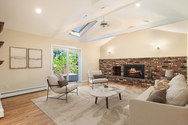59 Judith Dr, Danbury, CT 06811 - living area featuring a baseboard radiator, a skylight, light wood-type flooring, and a brick fireplace