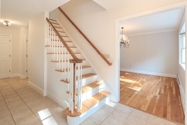 59 Judith Dr, Danbury, CT 06811 - stairs with a chandelier, tile patterned floors, and crown molding