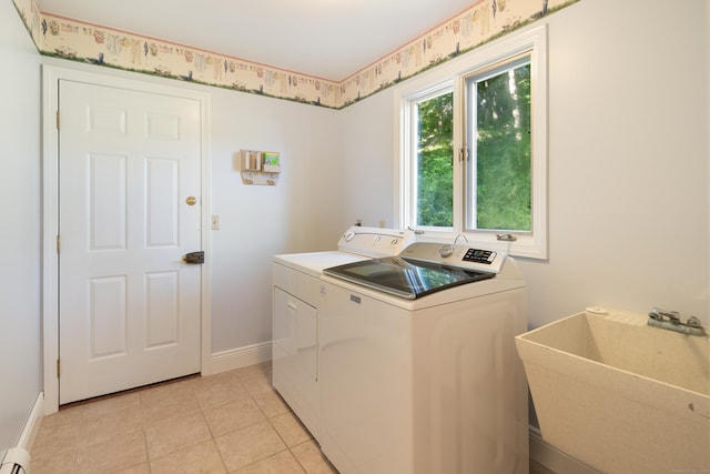 59 Judith Dr, Danbury, CT 06811 - washroom with washing machine and clothes dryer, a baseboard radiator, and light tile patterned floors