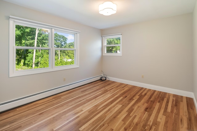 59 Judith Dr, Danbury, CT 06811 - spare room featuring a baseboard radiator and light wood-type flooring