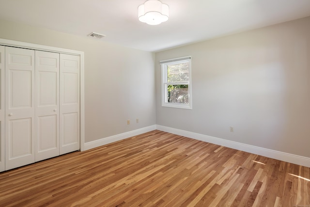 59 Judith Dr, Danbury, CT 06811 - unfurnished bedroom featuring light wood-style floors and a closet