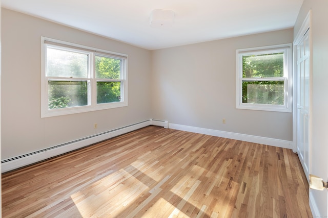 59 Judith Dr, Danbury, CT 06811 - spare room featuring a baseboard heating unit and light wood finished floors