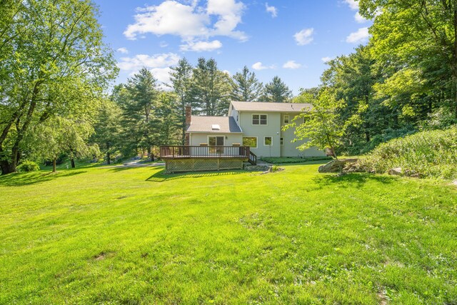 59 Judith Dr, Danbury, CT 06811 - view of green lawn featuring a deck