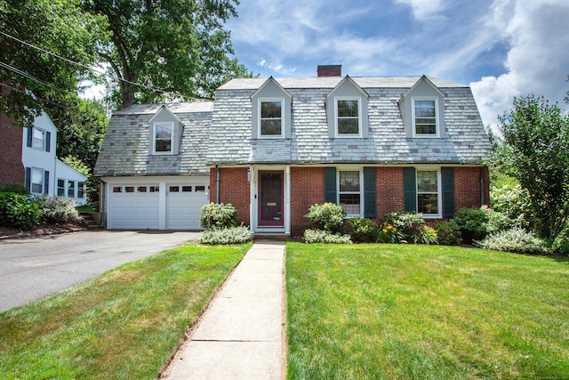 23 Mountain View Dr, West Hartford, CT 06117 - colonial inspired home featuring a chimney, brick siding, asphalt driveway, a front lawn, and a high end roof