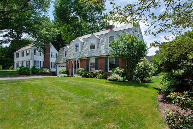 23 Mountain View Dr, West Hartford, CT 06117 - colonial inspired home featuring a chimney, a garage, brick siding, and a front lawn