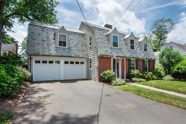 23 Mountain View Dr, West Hartford, CT 06117 - view of front of home featuring driveway, a garage, brick siding, and a chimney
