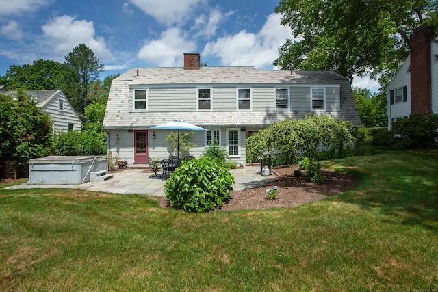 23 Mountain View Dr, West Hartford, CT 06117 - rear view of house with a chimney, a patio, a gambrel roof, a hot tub, and a yard