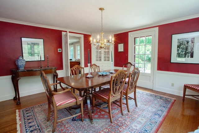 23 Mountain View Dr, West Hartford, CT 06117 - dining area featuring a chandelier, wood finished floors, wainscoting, and crown molding