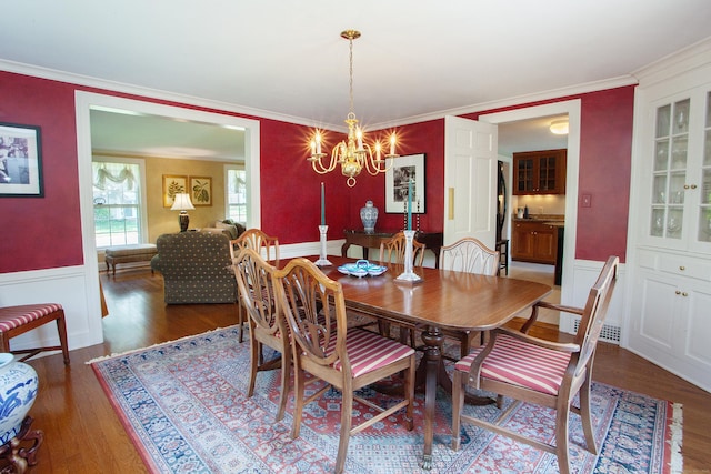23 Mountain View Dr, West Hartford, CT 06117 - dining room with a chandelier, wood finished floors, and crown molding