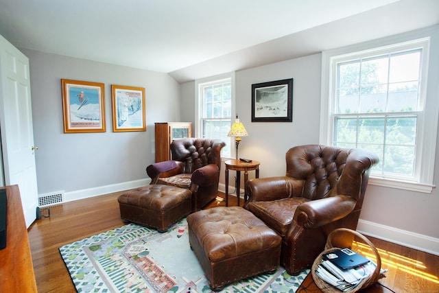 23 Mountain View Dr, West Hartford, CT 06117 - sitting room with wood finished floors, healthy amount of natural light, and lofted ceiling