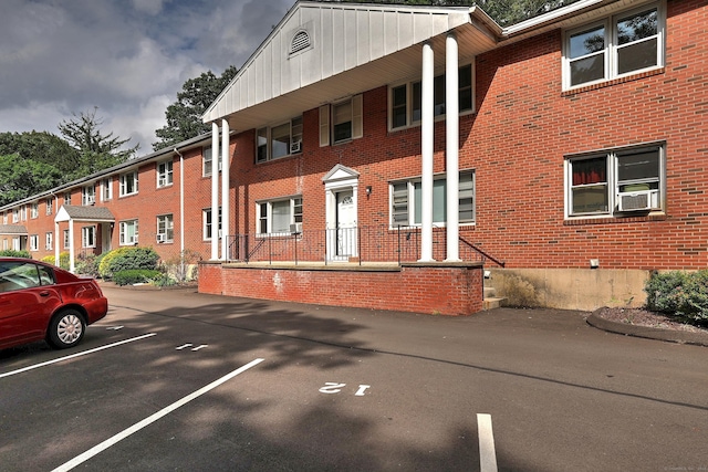 56 Wakelee Avenue Ext Unit 12, Shelton, CT 06484 - view of building exterior featuring uncovered parking and cooling unit