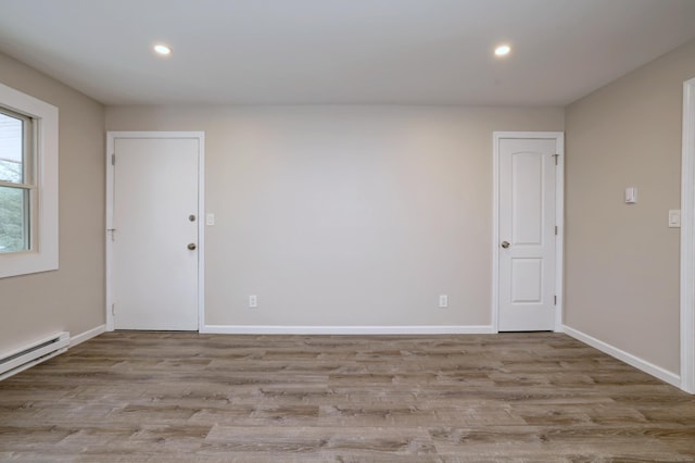 56 Wakelee Avenue Ext Unit 12, Shelton, CT 06484 - spare room with wood finished floors, recessed lighting, and a baseboard heating unit