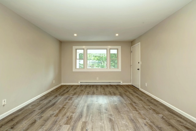 56 Wakelee Avenue Ext Unit 12, Shelton, CT 06484 - spare room featuring a baseboard radiator, wood finished floors, and recessed lighting