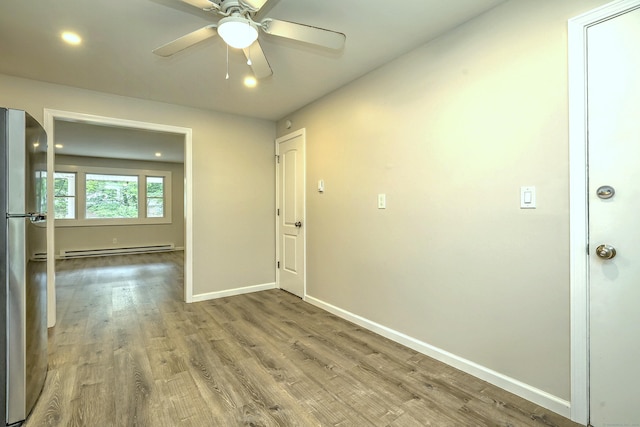 56 Wakelee Avenue Ext Unit 12, Shelton, CT 06484 - corridor with a baseboard heating unit, wood finished floors, and recessed lighting