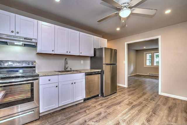 56 Wakelee Avenue Ext Unit 12, Shelton, CT 06484 - kitchen with stainless steel appliances, under cabinet range hood, recessed lighting, a ceiling fan, and light wood-style flooring