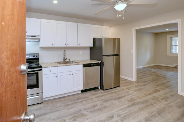 56 Wakelee Avenue Ext Unit 12, Shelton, CT 06484 - kitchen with stainless steel appliances, under cabinet range hood, ceiling fan, white cabinets, and light wood finished floors
