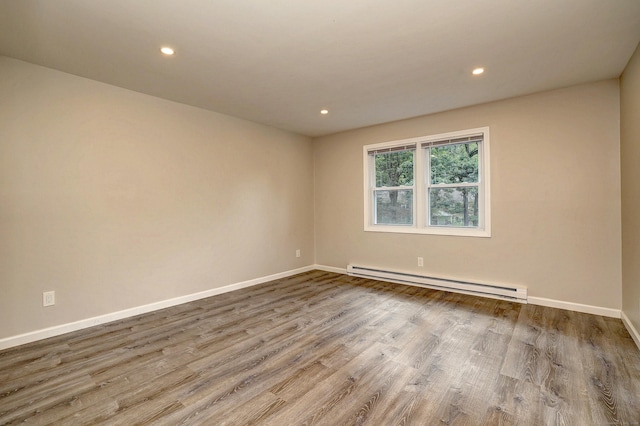 56 Wakelee Avenue Ext Unit 12, Shelton, CT 06484 - spare room featuring baseboard heating, wood finished floors, and recessed lighting