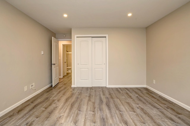 56 Wakelee Avenue Ext Unit 12, Shelton, CT 06484 - unfurnished bedroom with recessed lighting, light wood-style flooring, and a closet