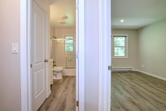56 Wakelee Avenue Ext Unit 12, Shelton, CT 06484 - bathroom featuring baseboard heating, enclosed tub / shower combo, and wood finished floors