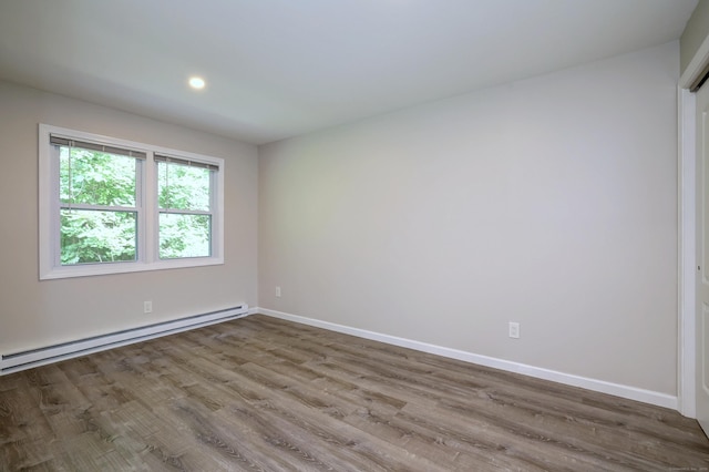 56 Wakelee Avenue Ext Unit 12, Shelton, CT 06484 - unfurnished room featuring a baseboard radiator, wood finished floors, and recessed lighting