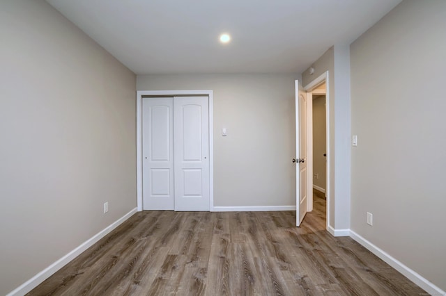 56 Wakelee Avenue Ext Unit 12, Shelton, CT 06484 - unfurnished bedroom with wood finished floors and a closet