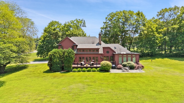168 Sunset Hill Rd, Redding, CT 06896 - back of property with a deck, a lawn, a chimney, french doors, and a patio