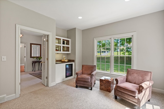 168 Sunset Hill Rd, Redding, CT 06896 - sitting room featuring a bar, light carpet, recessed lighting, beverage cooler, and light tile patterned floors