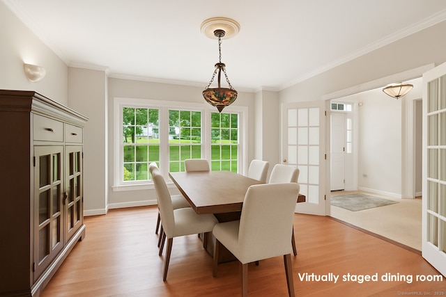 168 Sunset Hill Rd, Redding, CT 06896 - dining room with light wood-style floors, ornamental molding, and french doors
