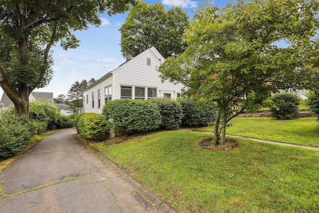 9 Fairfield Ave, Danbury, CT 06810 - view of front of home with a front lawn and a chimney