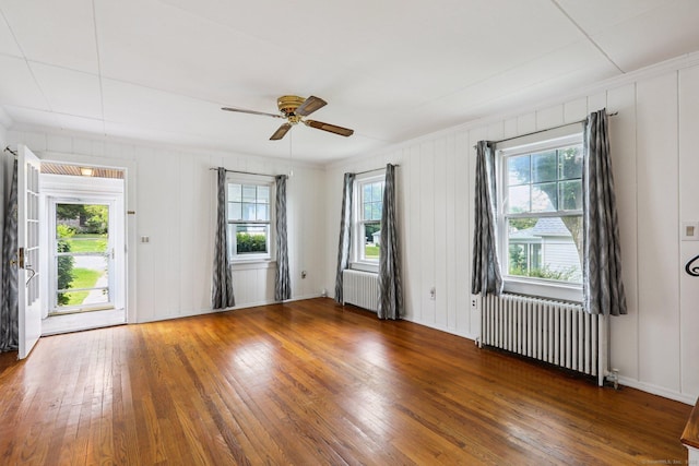 9 Fairfield Ave, Danbury, CT 06810 - empty room with radiator, wood-type flooring, and ceiling fan