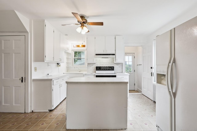 9 Fairfield Ave, Danbury, CT 06810 - kitchen featuring white refrigerator with ice dispenser, range, under cabinet range hood, ceiling fan, and white cabinetry