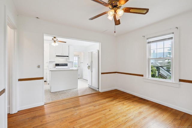 9 Fairfield Ave, Danbury, CT 06810 - unfurnished living room featuring a ceiling fan and light wood-type flooring