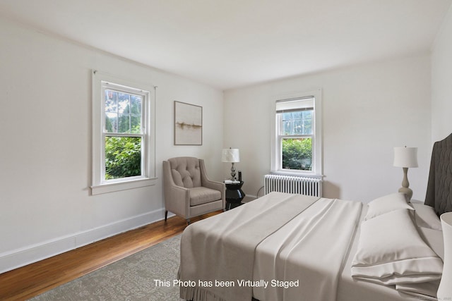 9 Fairfield Ave, Danbury, CT 06810 - bedroom with radiator heating unit and wood finished floors